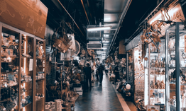 pexels-photo-6777506-6777506 A lively indoor market with diverse stalls and shoppers enhancing a vibrant shopping experience.