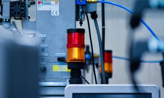 pexels-photo-33427061-33427061 Detailed view of automated machinery with warning signals in an industrial setting.