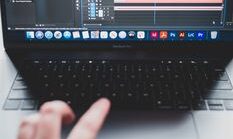 pexels-photo-7485211-7485211 Crop unrecognizable male programmer typing on netbook while working on project and creating music